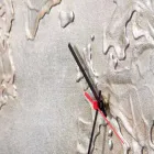 Modern clock with five quadrants depicting the world Miles Viadurini